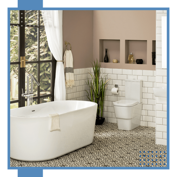 bathroom with tiled wall and mosaic floor