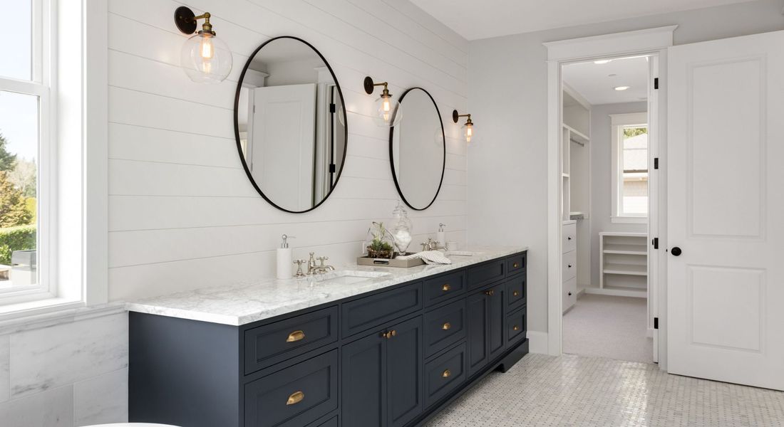 bathroom with marble countertop