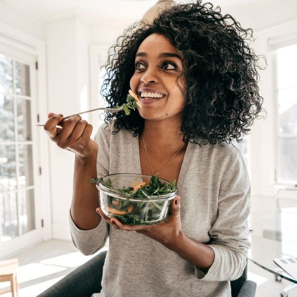 woman eating salad