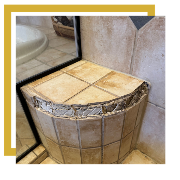 Close-up of tiled shower bench with fresh grout repair