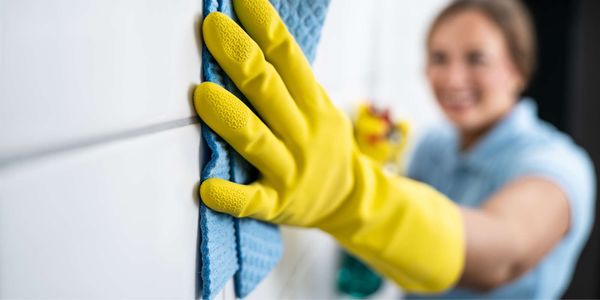 woman cleaning grout