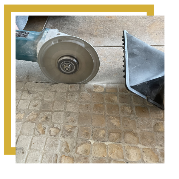 cutting out old grout 