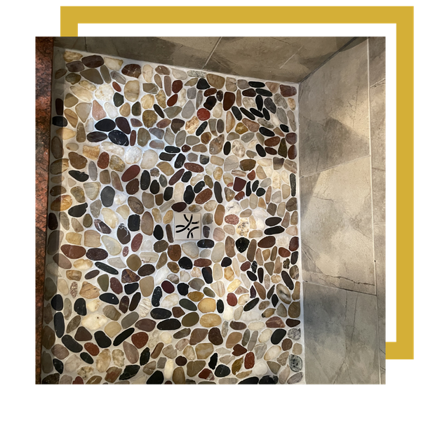 river rock tile in shower 