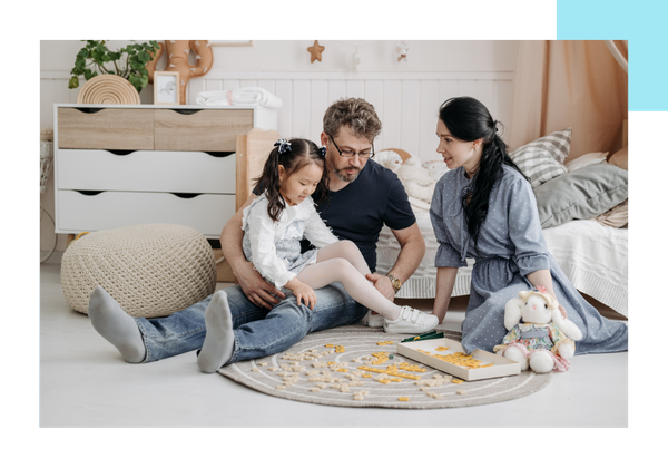 family playing board game
