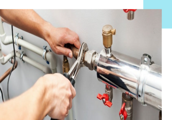 plumber working on pipes