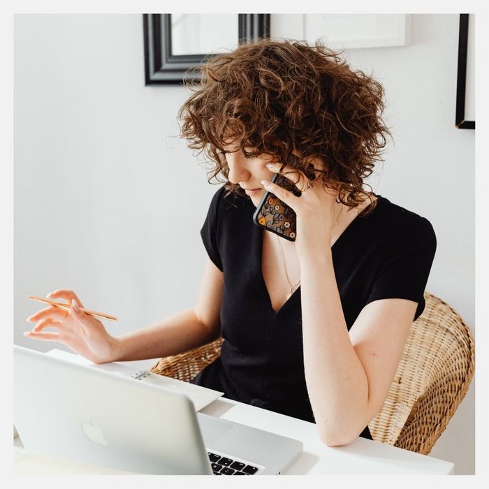 younger woman on the phone