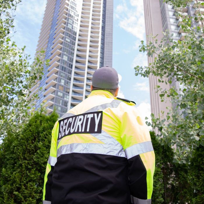 a security guard walking into a business How Private Security Can Create Safer Work Environments.jpg