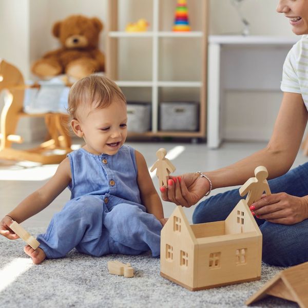 Toddler playing with mom