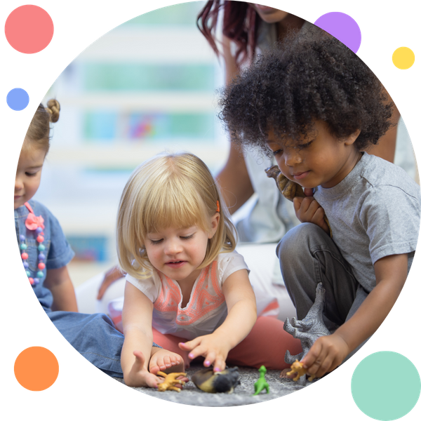 toddlers playing with dinosaurs in daycare