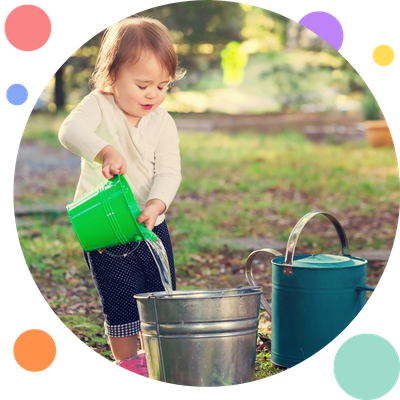 child outside pouring water 