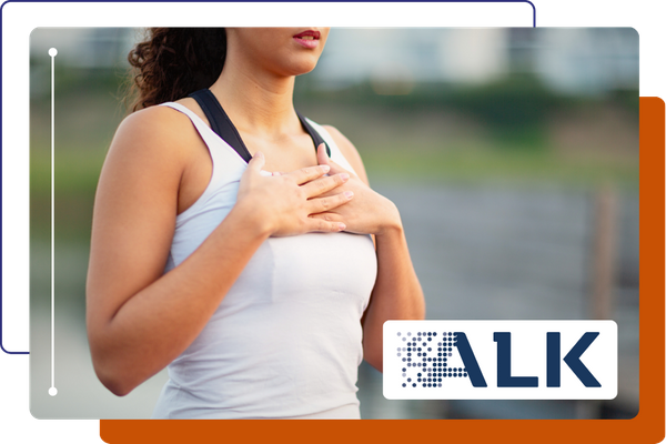 woman holding her chest