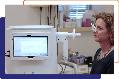 woman using the PulmOne machine