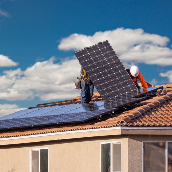 solar panels being installed on a home roof
