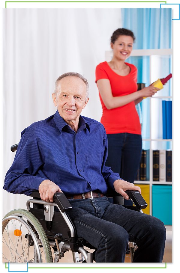 Woman cleaning behind man in wheelchair