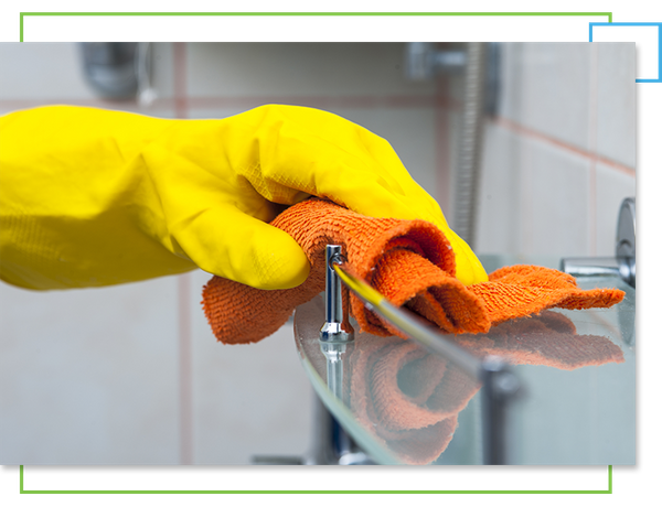 Cleaning bathroom wearing yellow gloves