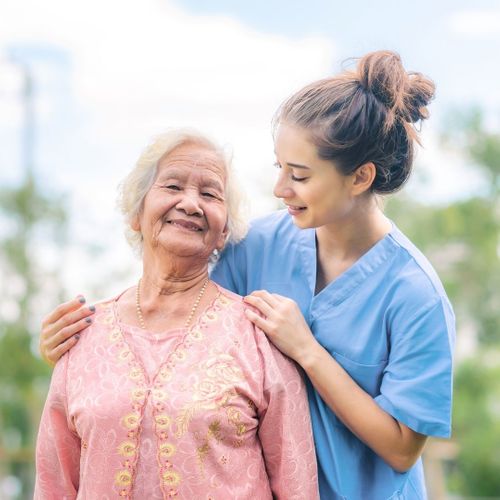 elderly woman with caregiver
