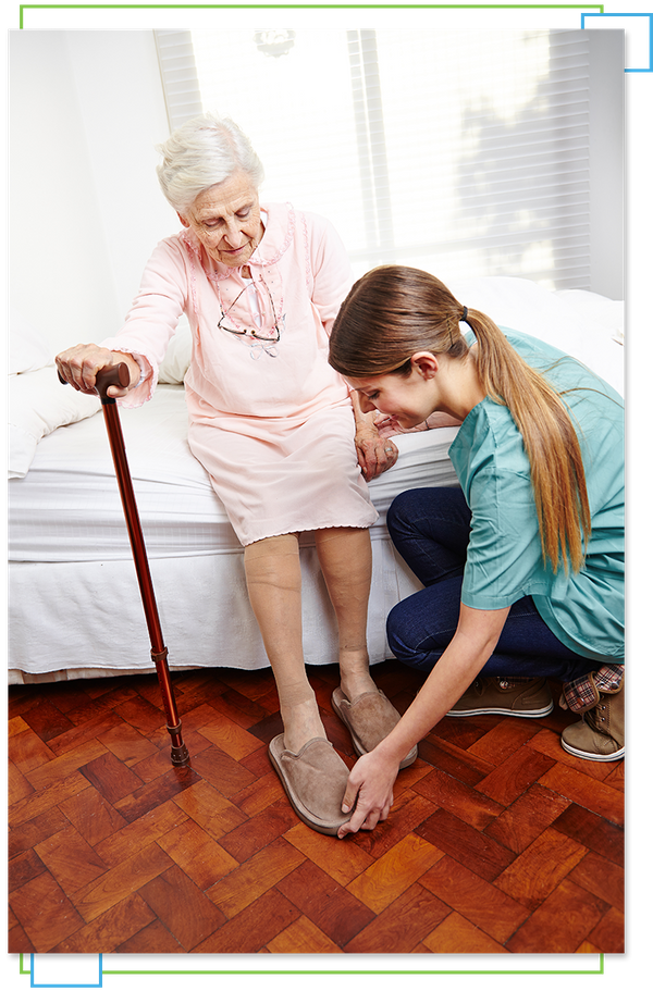 Woman helping elder with dressing at home