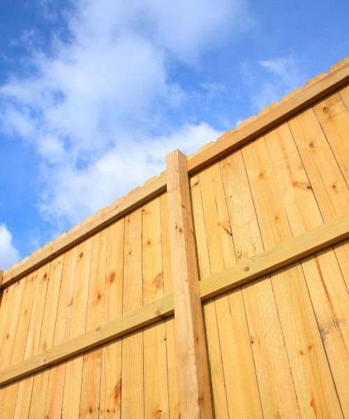 A tall, wooden privacy fence