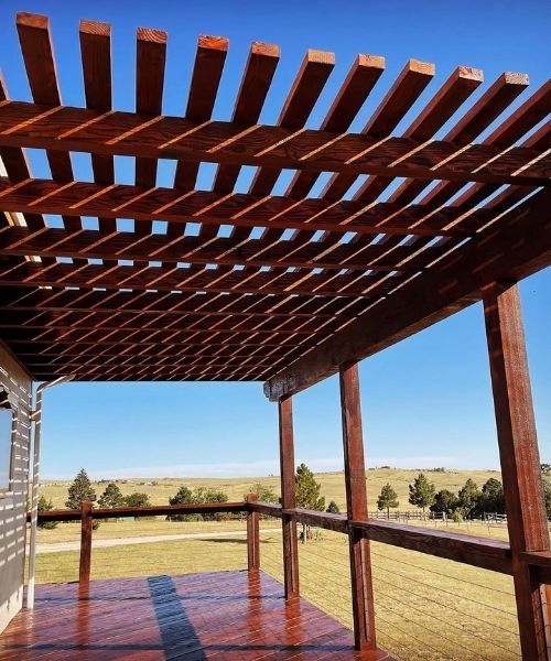 A pergola on a deck