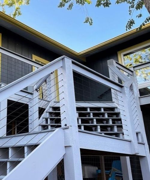 A deck with stairs and railings