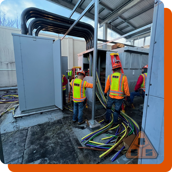 electricians working on commercial equipment