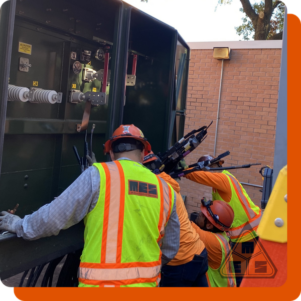 technicians working on outdoor electrical box