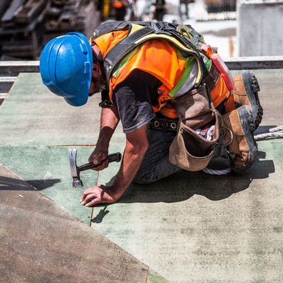 construction worker hammering nail