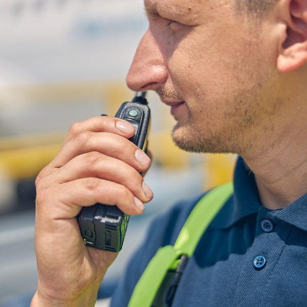 man talking in two way radio