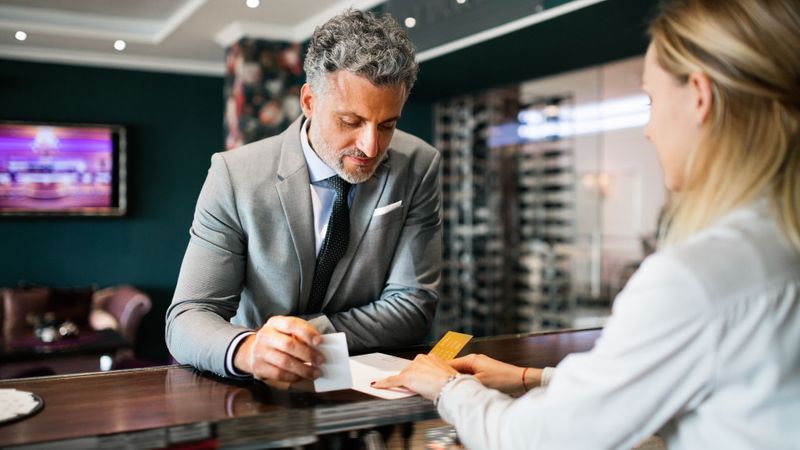 man checking in at hotel