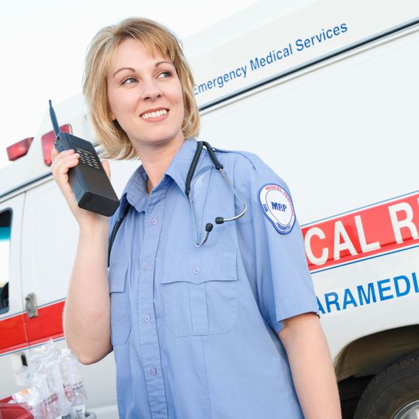 woman in healthcare using two way radio