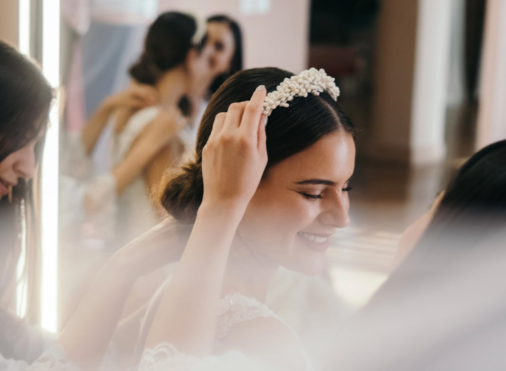 Bridal hair with headband being placed