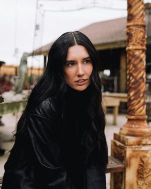 woman outside with long dark brown hair