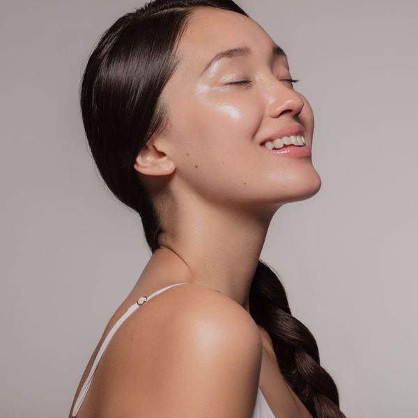 woman with moisturized skin smiling