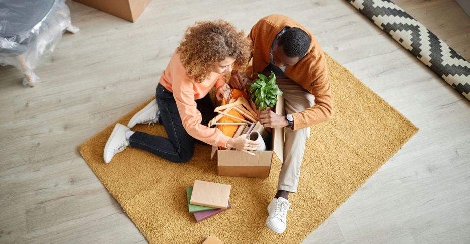 people unpacking a box