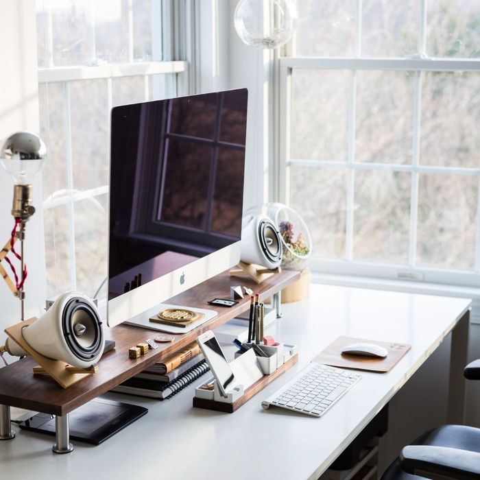 organized desk by a window