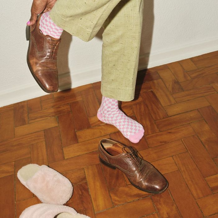 woman putting shoes on