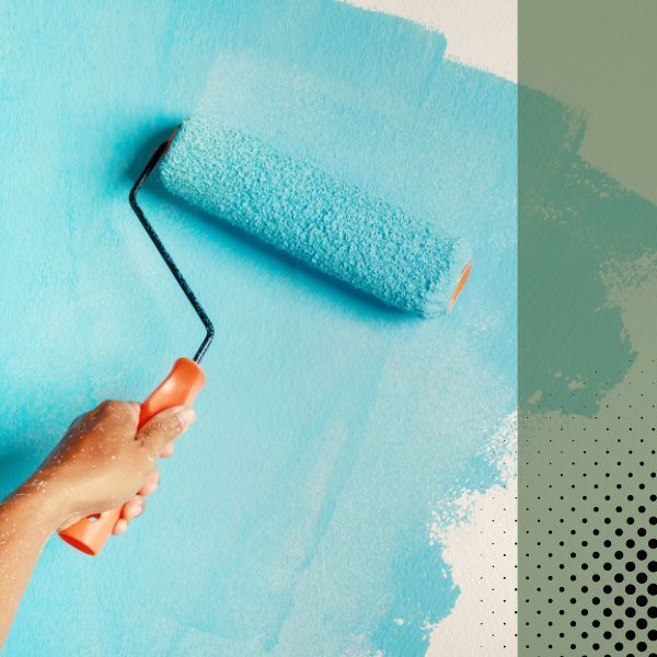 using roller to paint wall