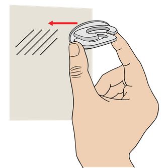 The Original Squatchee™ adhesive hat hook being pressed firmly onto a clean, smooth wall surface. Install Squatchee™ Adhesive Hat Hook