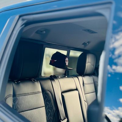 The Original Squatchee™ - Hit the Road: Hats on the Inside Rear Window of Your Truck