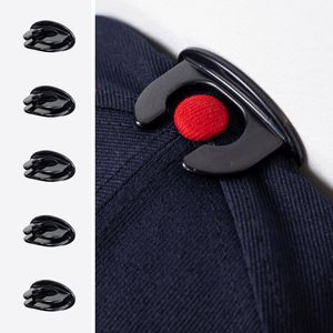 A detailed image of The Original Squatchee™ adhesive hat hook holding a hat, showcasing its unique patented design and secure fit for hat collections. Close-Up of Hat Hook in Use