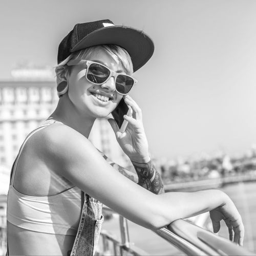 A person wearing a baseball cap representing the pride and passion behind every baseball cap collection displayed with The Original Squatchee™ patented adhesive hat hooks. Hat Collector Ready to Display Baseball Caps