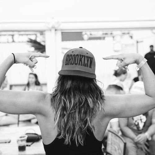 A woman wearing baseball a cap representing the growing community of hat lovers inspired by The Original Squatchee™. Women Wearing a Baseball Cap