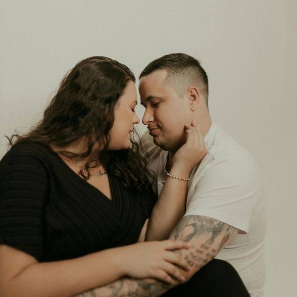 A couple holding each other intimately. 