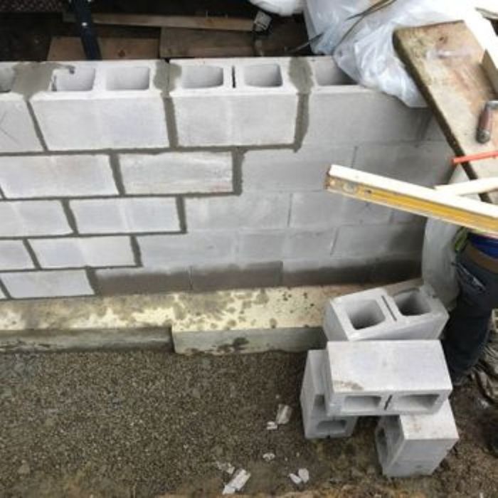 a cinder block foundation repair in progress