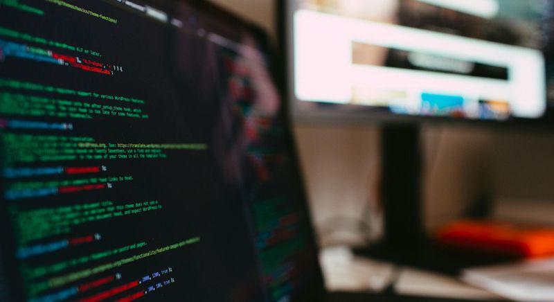 computers with code on screen
