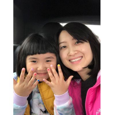 Mother and daughter show hearts on her nails, proud to smile for the camera. 2.jpg