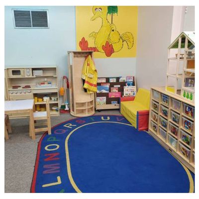 play house and lots of containers with toys, kitchen set for play time, and bookshelf filled with picture books