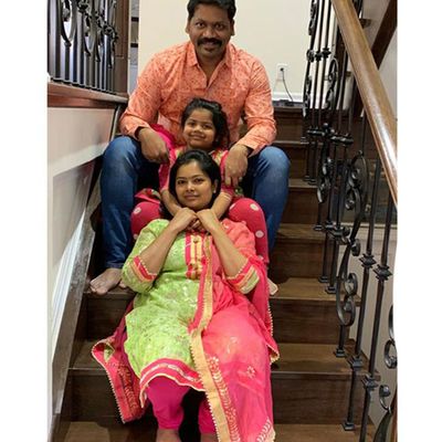 family sit on stairs proud to be club members 5.jpg