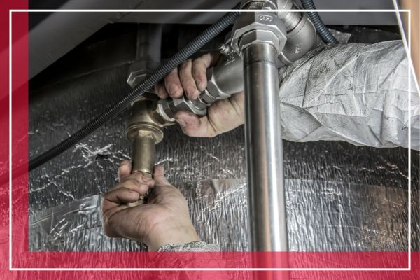 plumber repairing pipes