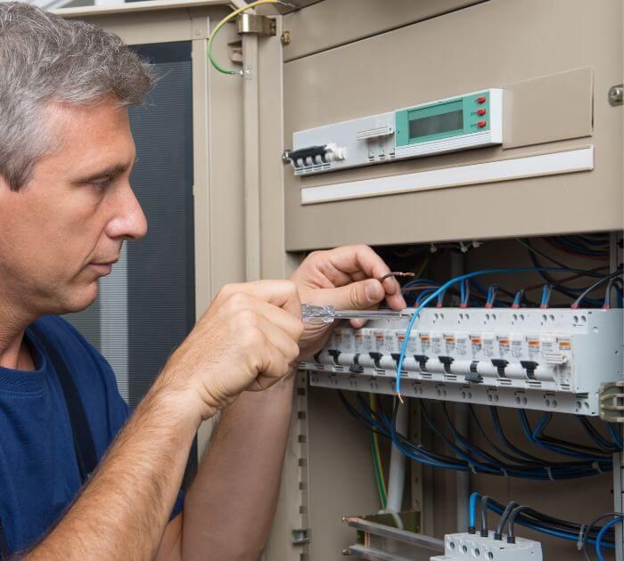 electrician fixing circuit breaker